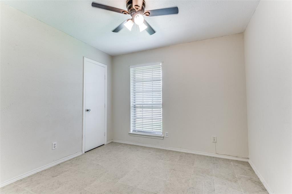 1805 Etain Road Irving, TX 75060 - Photo 16 of 23 an empty room with windows and fan