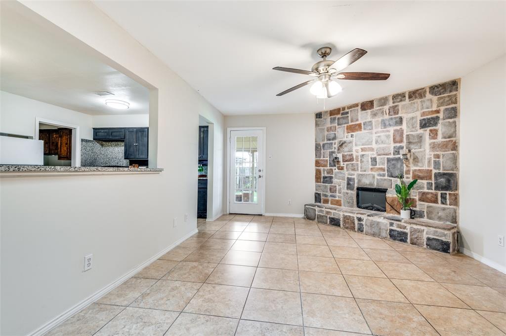 1805 Etain Road Irving, TX 75060 - Photo 2 of 23 a view of a livingroom with furniture and a ceiling fan