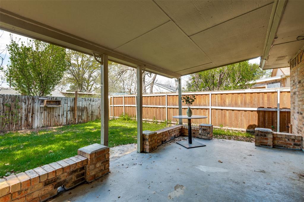 1805 Etain Road Irving, TX 75060 - Photo 21 of 23 a view of a yard with furniture and floor to ceiling window