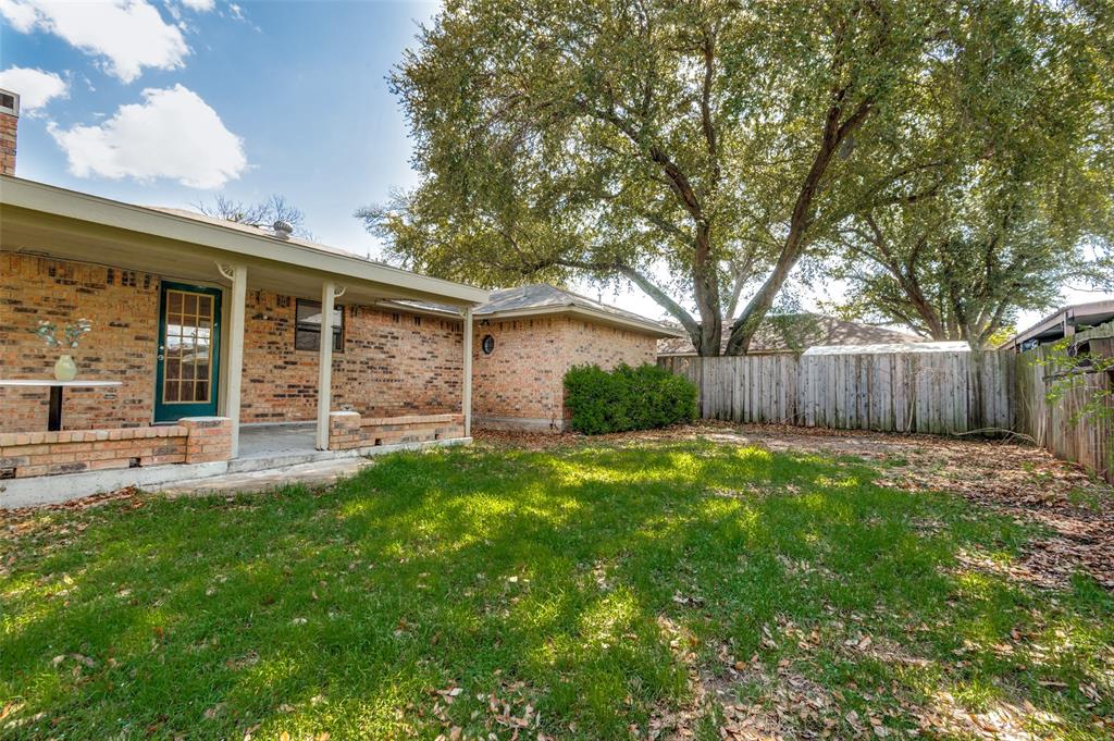 1805 Etain Road Irving, TX 75060 - Photo 22 of 23 front view of a house with a yard