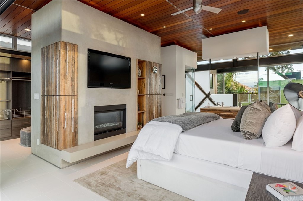 464 34th Street Manhattan Beach, CA 90266 - Photo 11 of 54 a living room with furniture a flat screen tv and a fireplace