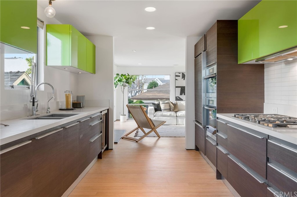 464 34th Street Manhattan Beach, CA 90266 - Photo 23 of 54 a kitchen with a stove a sink and a refrigerator