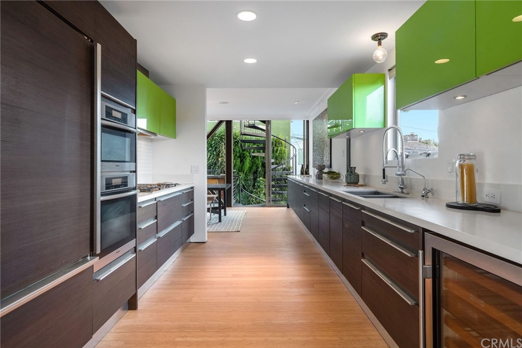 464 34th Street Manhattan Beach, CA 90266 - Photo 25 of 54 a large kitchen with stainless steel appliances kitchen island a large counter top