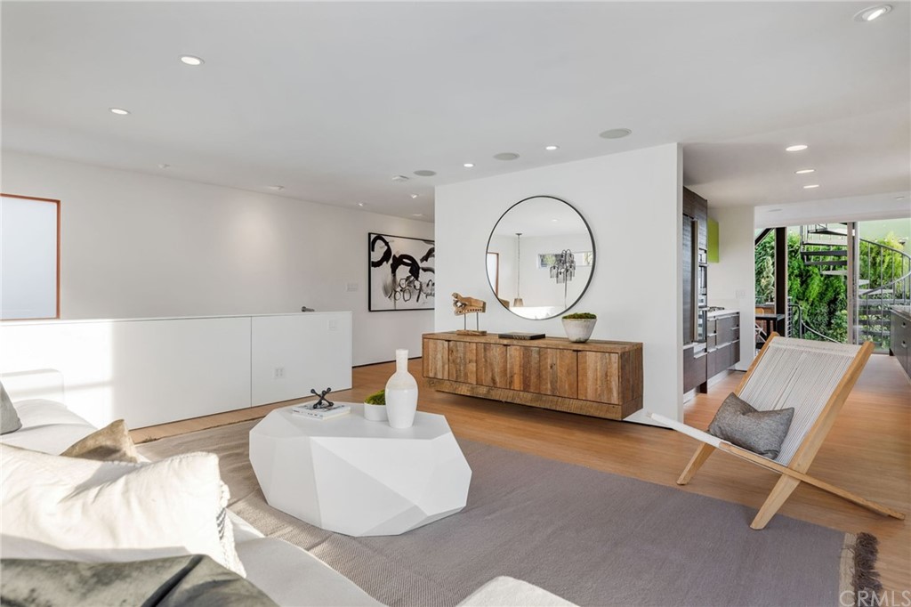 464 34th Street Manhattan Beach, CA 90266 - Photo 34 of 54 a living room with furniture a large window and a chandelier
