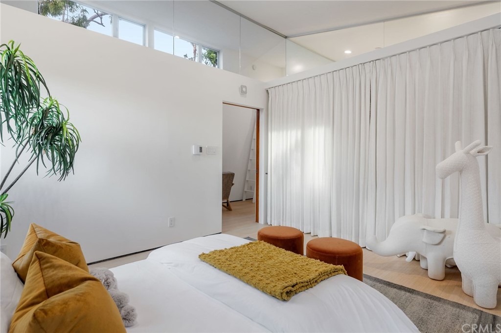 464 34th Street Manhattan Beach, CA 90266 - Photo 36 of 54 a bedroom with a bed and furniture