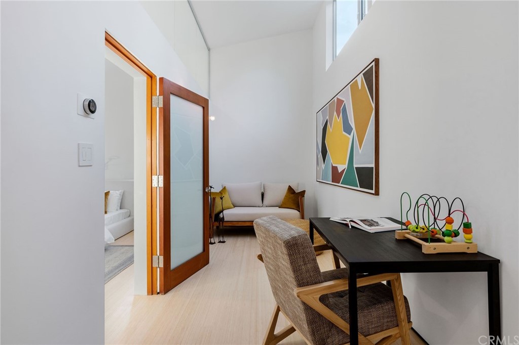 464 34th Street Manhattan Beach, CA 90266 - Photo 39 of 54 a view of a workspace with furniture and a window