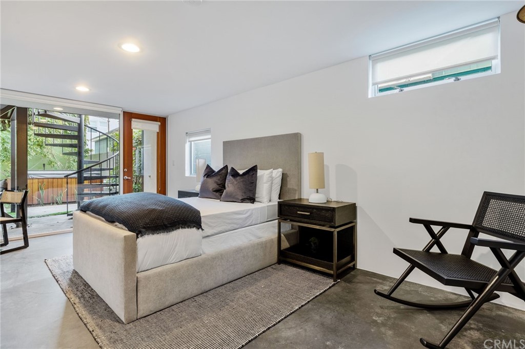 464 34th Street Manhattan Beach, CA 90266 - Photo 41 of 54 a bedroom with a bed and chair