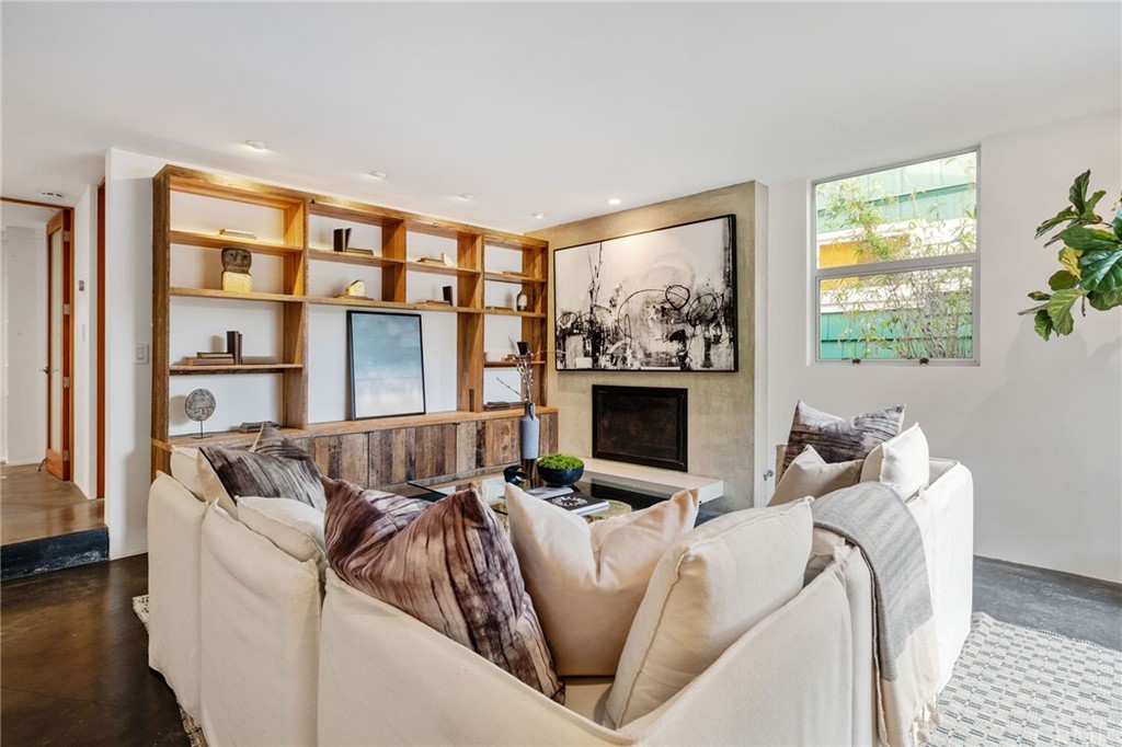 464 34th Street Manhattan Beach, CA 90266 - Photo 50 of 54 a living room with furniture a fireplace and a window