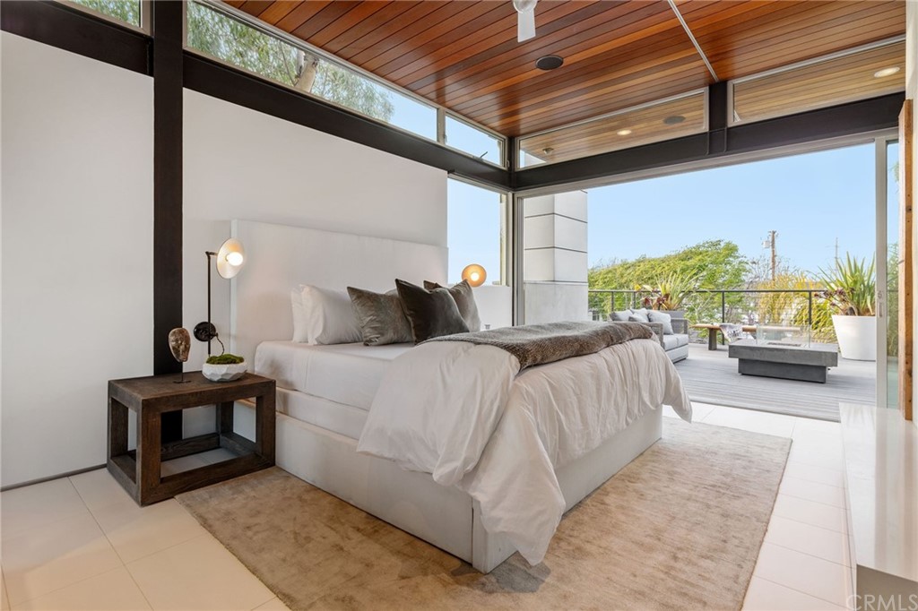 464 34th Street Manhattan Beach, CA 90266 - Photo 8 of 54 a bedroom with a bed and a night stand