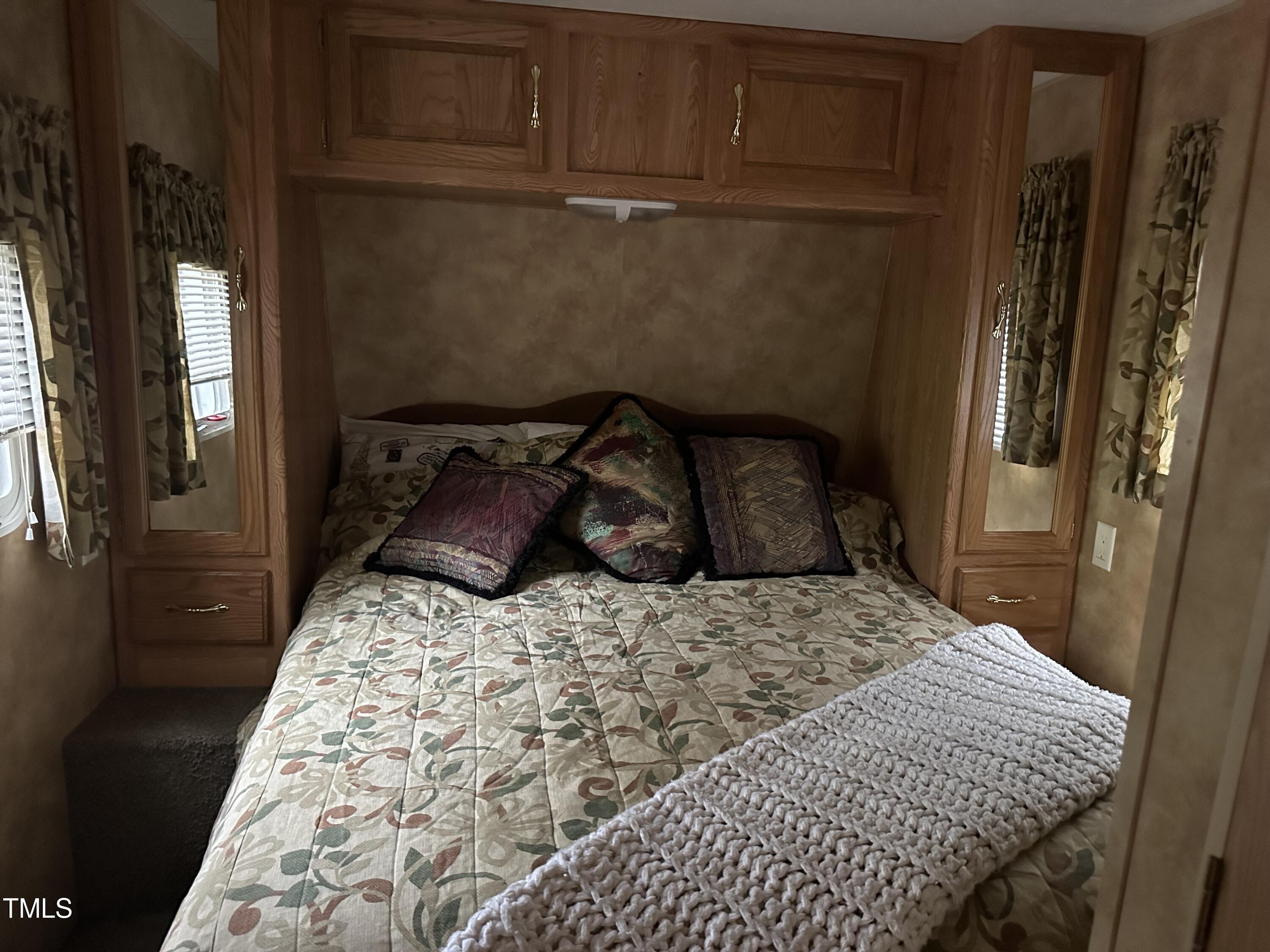 334 Cree Drive Spring Hope, NC 27882 - Photo 7 of 16 a bedroom with a bed and wooden floor