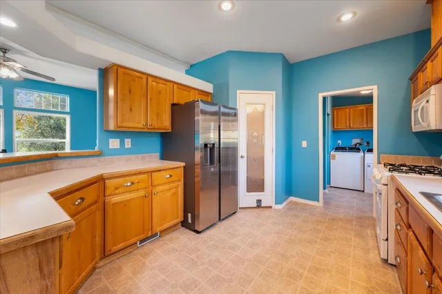 a kitchen with stainless steel appliances granite countertop a stove and a sink