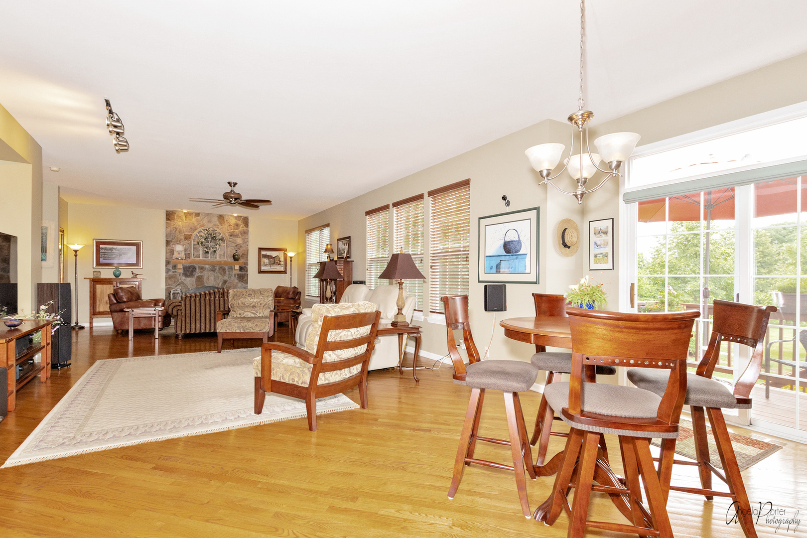 398 Sterling Circle Cary, IL 60013 - Photo 18 of 68 a view of a dining room with furniture a chandelier and large windows