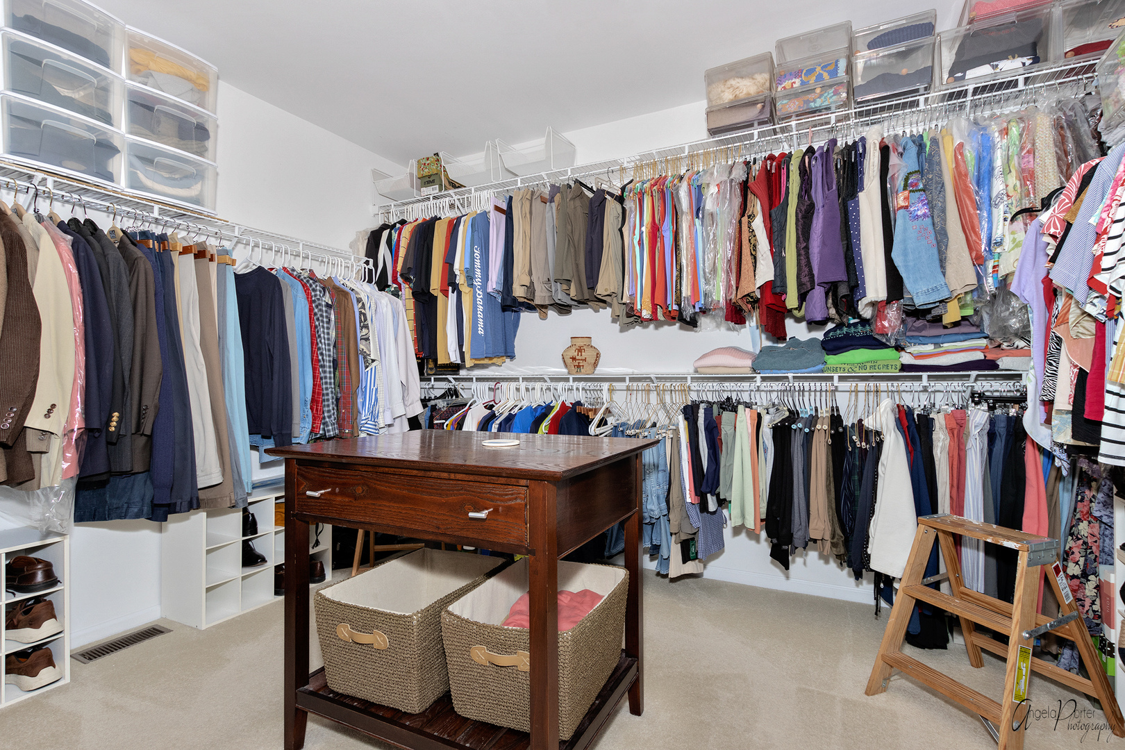 398 Sterling Circle Cary, IL 60013 - Photo 39 of 68 a view of walk in closet with clothes and shoes