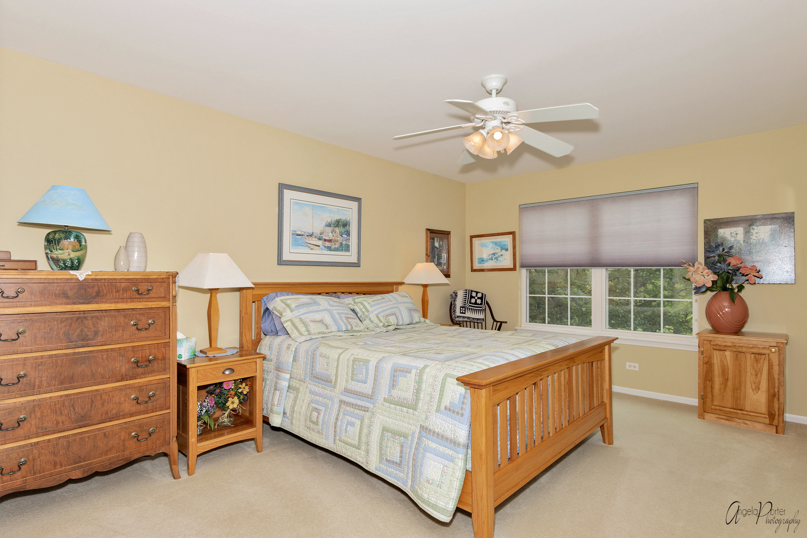 398 Sterling Circle Cary, IL 60013 - Photo 40 of 68 a bedroom with a bed and a chandelier