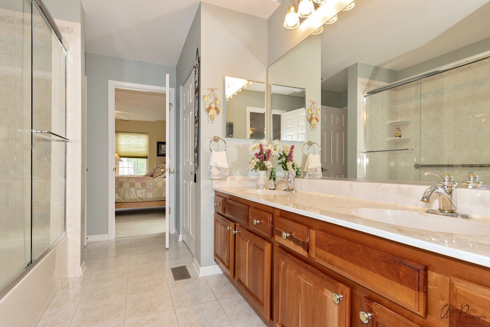398 Sterling Circle Cary, IL 60013 - Photo 41 of 68 a spacious en suite bathroom with a granite countertop sink mirror and shower