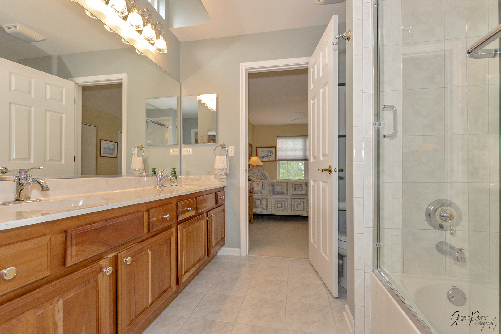 398 Sterling Circle Cary, IL 60013 - Photo 42 of 68 a spacious bathroom with a double vanity sink a mirror and a shower