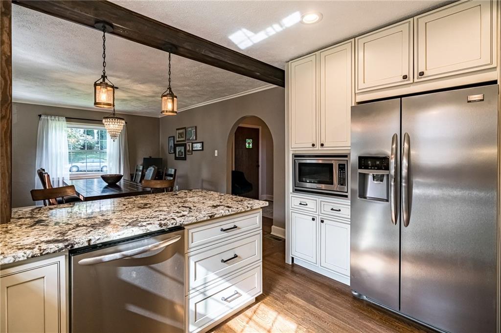 2814 Graham Boulevard Pittsburgh, PA 15235 - Photo 12 of 25 a kitchen with granite countertop a refrigerator and a sink