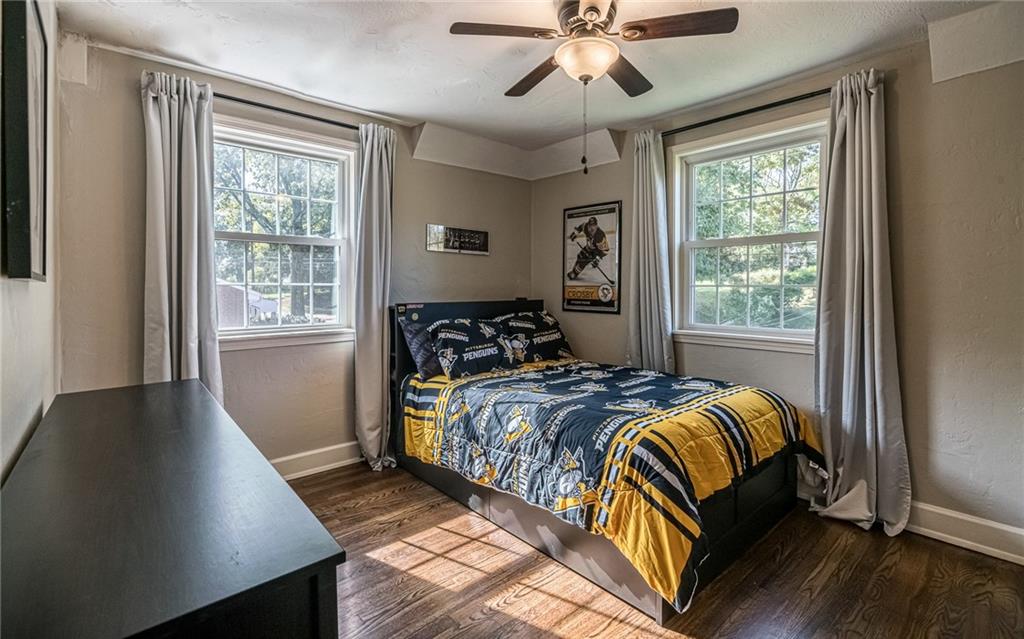 2814 Graham Boulevard Pittsburgh, PA 15235 - Photo 18 of 25 a bedroom with a bed and wooden floor