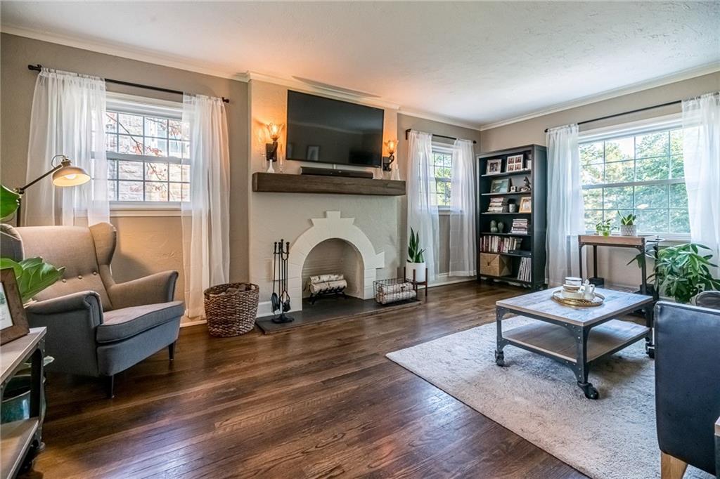 2814 Graham Boulevard Pittsburgh, PA 15235 - Photo 4 of 25 a living room with furniture flat screen tv and a fireplace