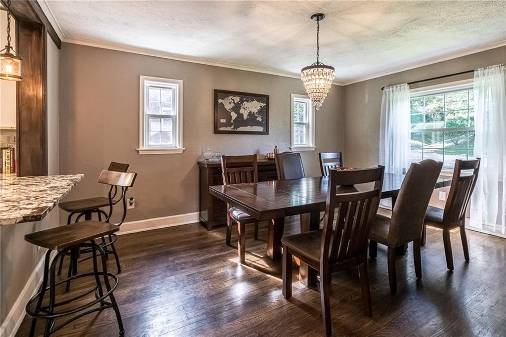 2814 Graham Boulevard Pittsburgh, PA 15235 - Photo 8 of 25 a dining room with furniture a chandelier and wooden floor