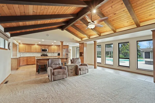 a large room with kitchen view