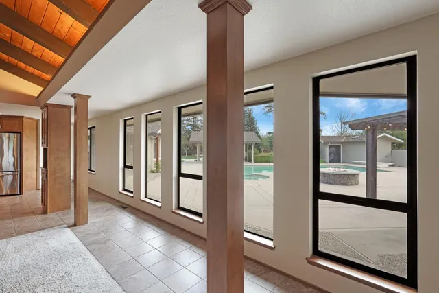 a view of a hallway with windows