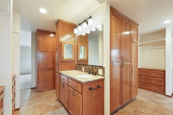 a bathroom with a sink double vanity and a mirror