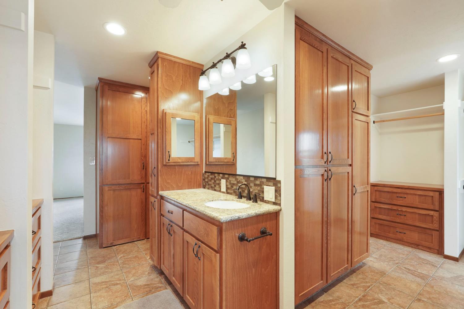 22022 South 99 Frontage Road Ripon, CA 95366 - Photo 20 of 46 a bathroom with a sink double vanity and a mirror