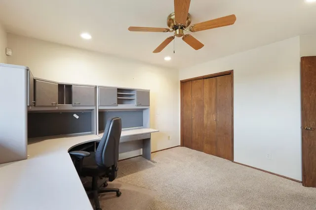 a view of a workspace with furniture