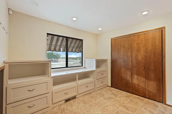 a view of a dresser with mirror