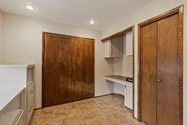 a view of a bathroom with a glass door and bathroom