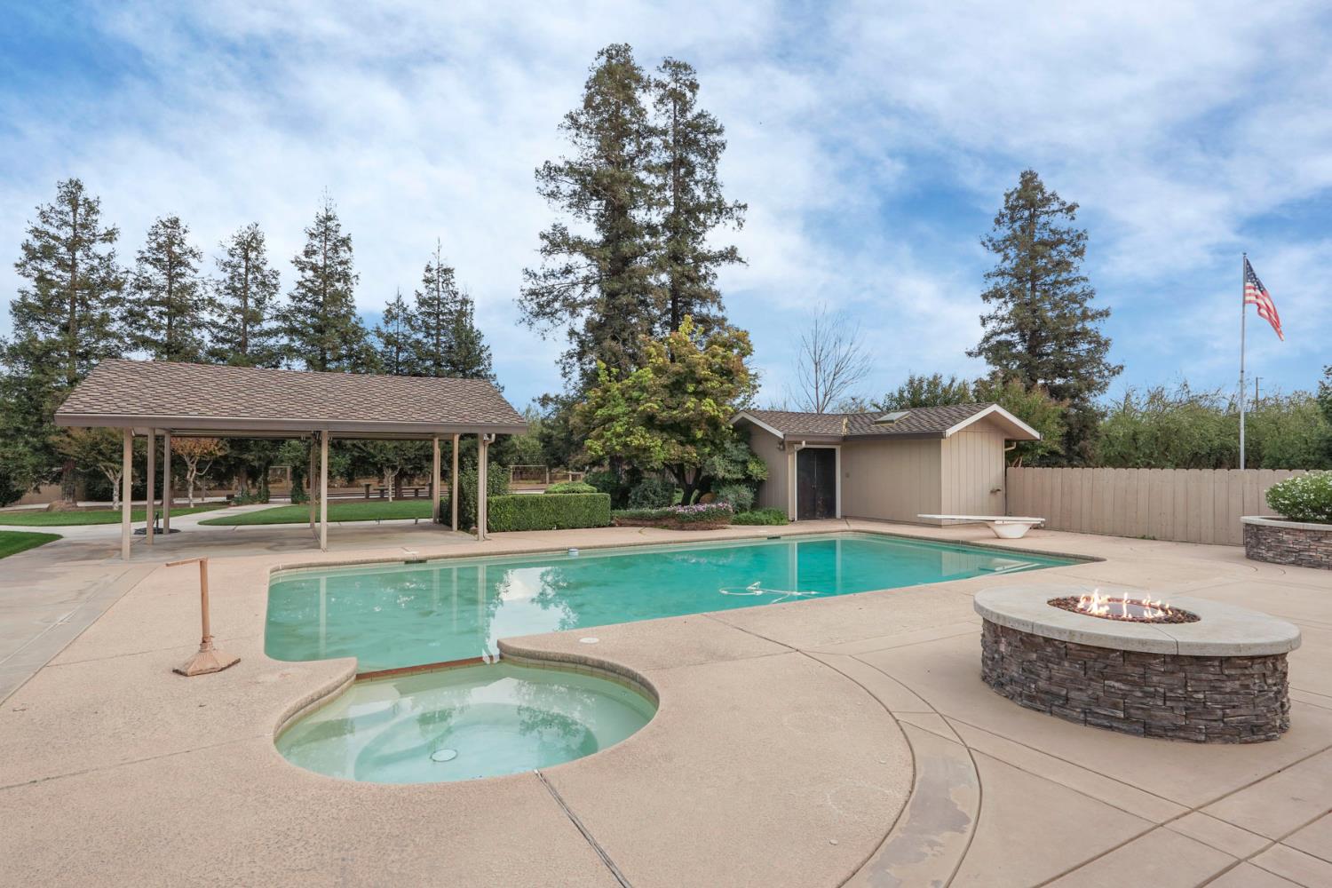 22022 South 99 Frontage Road Ripon, CA 95366 - Photo 35 of 46 a view of a house with a yard potted plants and a fountain