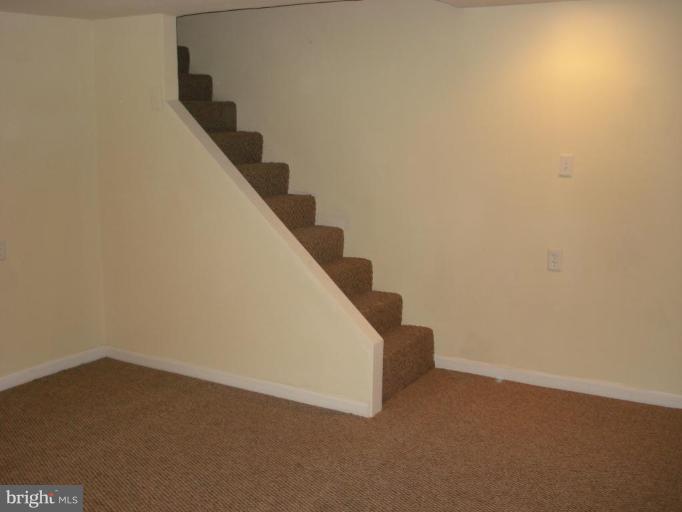 525 Old Riverside Road Brooklyn, MD 21225 - Photo 3 of 5 a view of an empty room with stairs