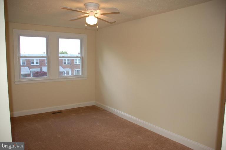 525 Old Riverside Road Brooklyn, MD 21225 - Photo 4 of 5 an empty room with a window