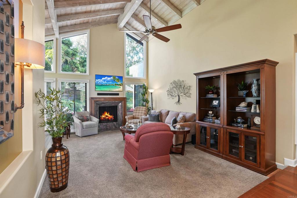1320 Sun Valley Road Solana Beach, CA 92075 - Photo 11 of 36 a living room with furniture a window and a fireplace