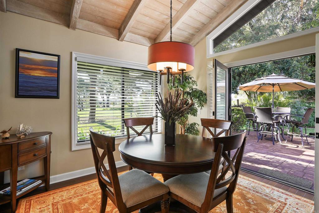 1320 Sun Valley Road Solana Beach, CA 92075 - Photo 16 of 36 a dining room with furniture and wooden floor