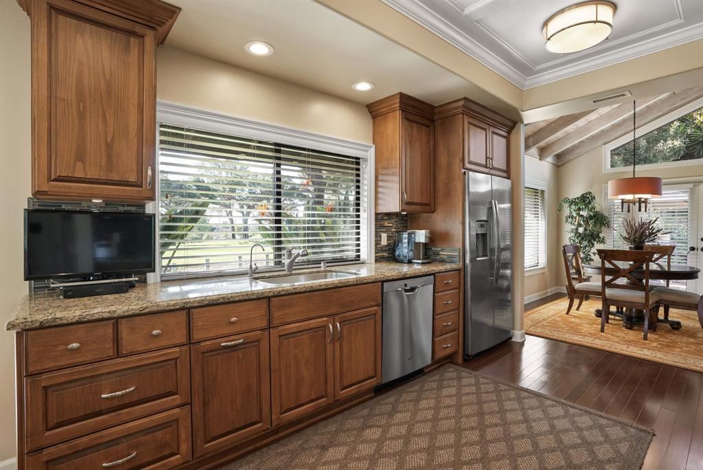 1320 Sun Valley Road Solana Beach, CA 92075 - Photo 20 of 36 a kitchen with stainless steel appliances granite countertop a stove a sink and a microwave