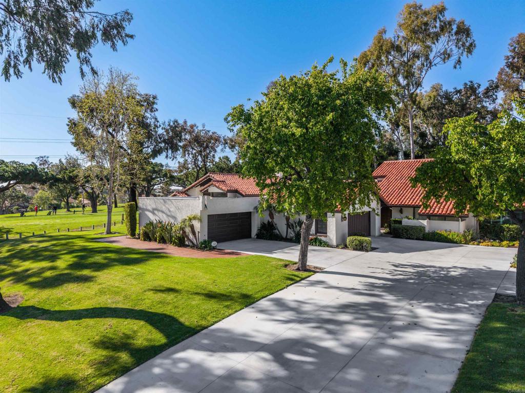 1320 Sun Valley Road Solana Beach, CA 92075 - Photo 2 of 36 a front view of a house with yard and green space
