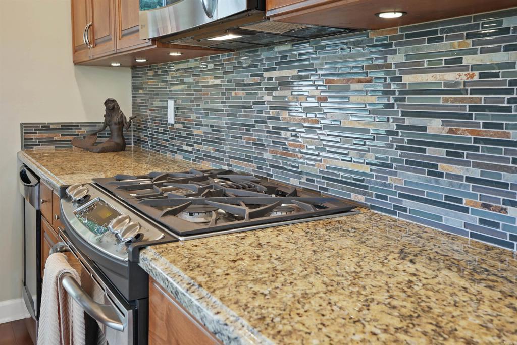 1320 Sun Valley Road Solana Beach, CA 92075 - Photo 21 of 36 a stove top oven sitting inside of a kitchen