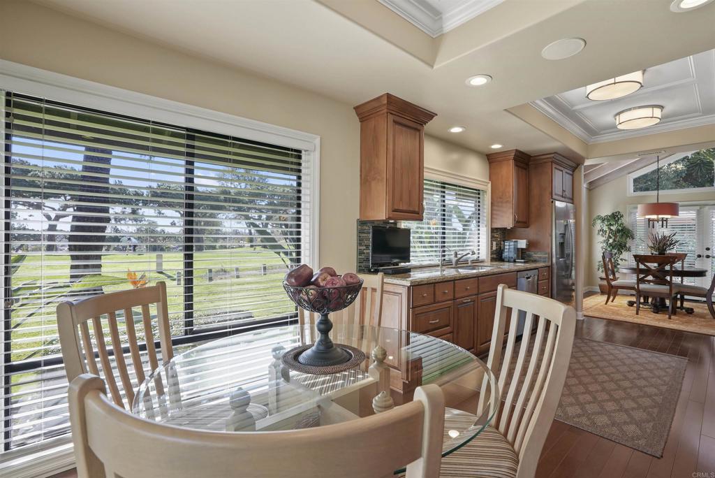 1320 Sun Valley Road Solana Beach, CA 92075 - Photo 24 of 36 a dining room with furniture a chandelier and wooden floor