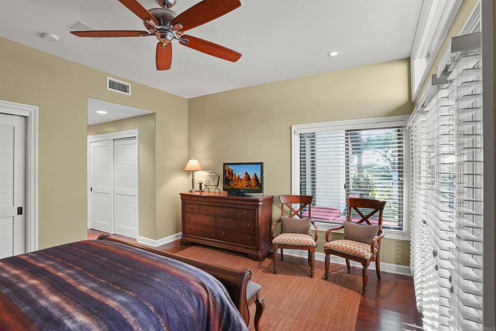1320 Sun Valley Road Solana Beach, CA 92075 - Photo 27 of 36 a bedroom with a bed and wooden floor