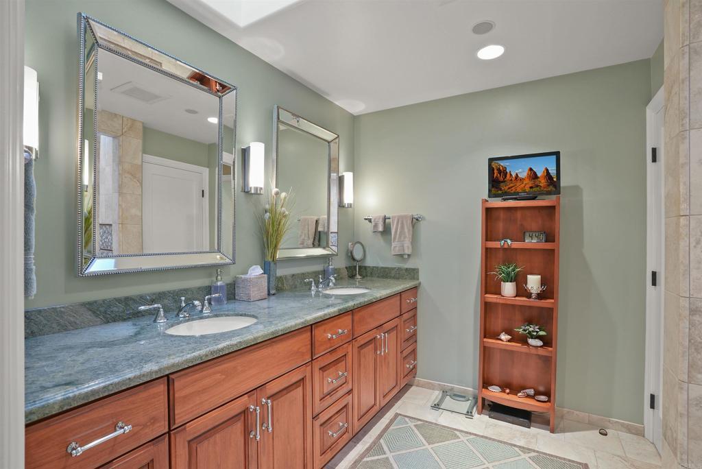 1320 Sun Valley Road Solana Beach, CA 92075 - Photo 28 of 36 a bathroom with double vanity sinks double vanity and a shower