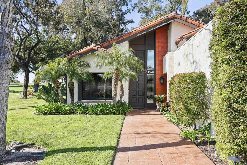 1320 Sun Valley Road Solana Beach, CA 92075 - Photo 3 of 36 a front view of a house with garden