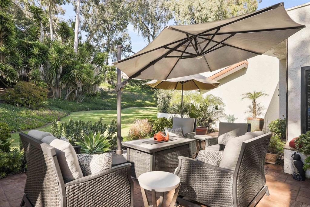 1320 Sun Valley Road Solana Beach, CA 92075 - Photo 6 of 36 a view of a patio with couches chairs and a umbrella