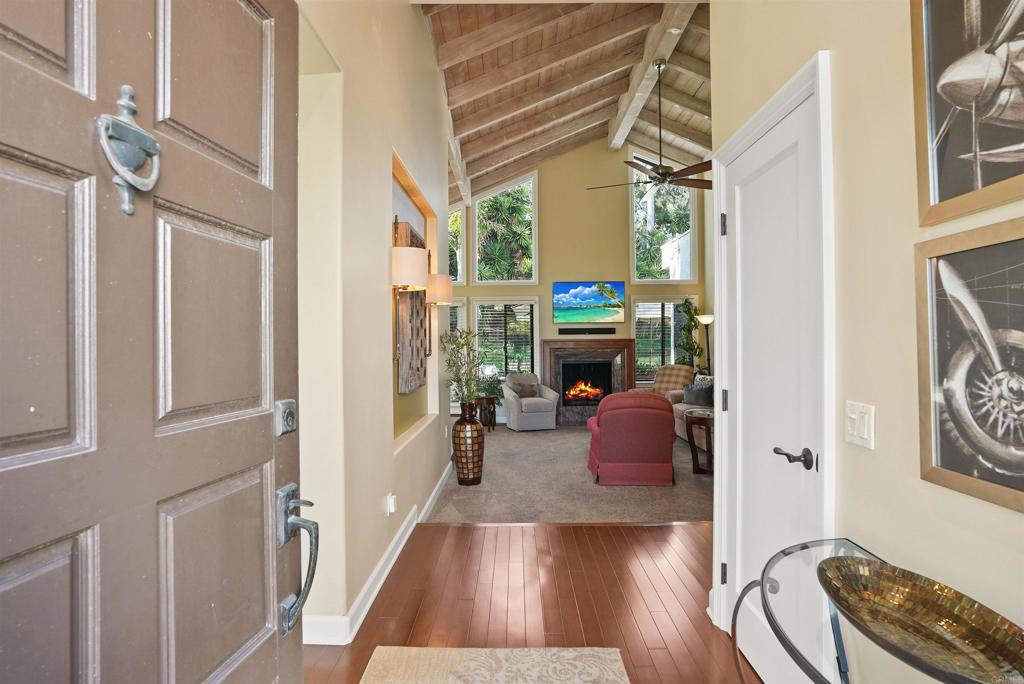 1320 Sun Valley Road Solana Beach, CA 92075 - Photo 10 of 36 a living room with furniture and a fireplace