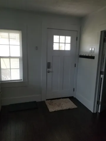 a view of an empty room and window