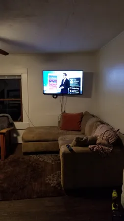 a living room with furniture and a rug