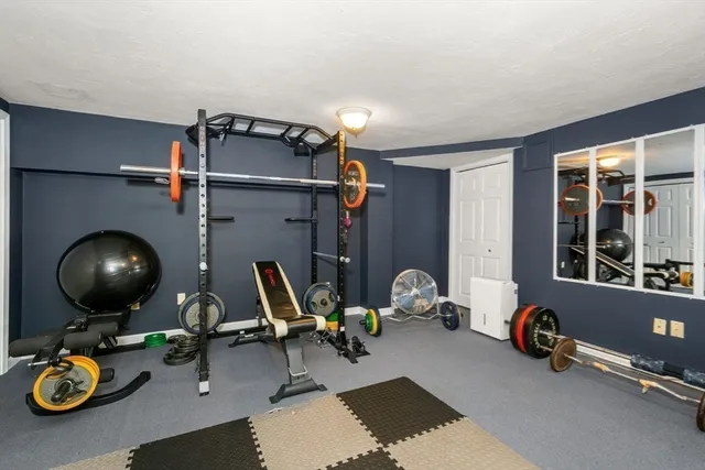 a room with furniture and gym equipment