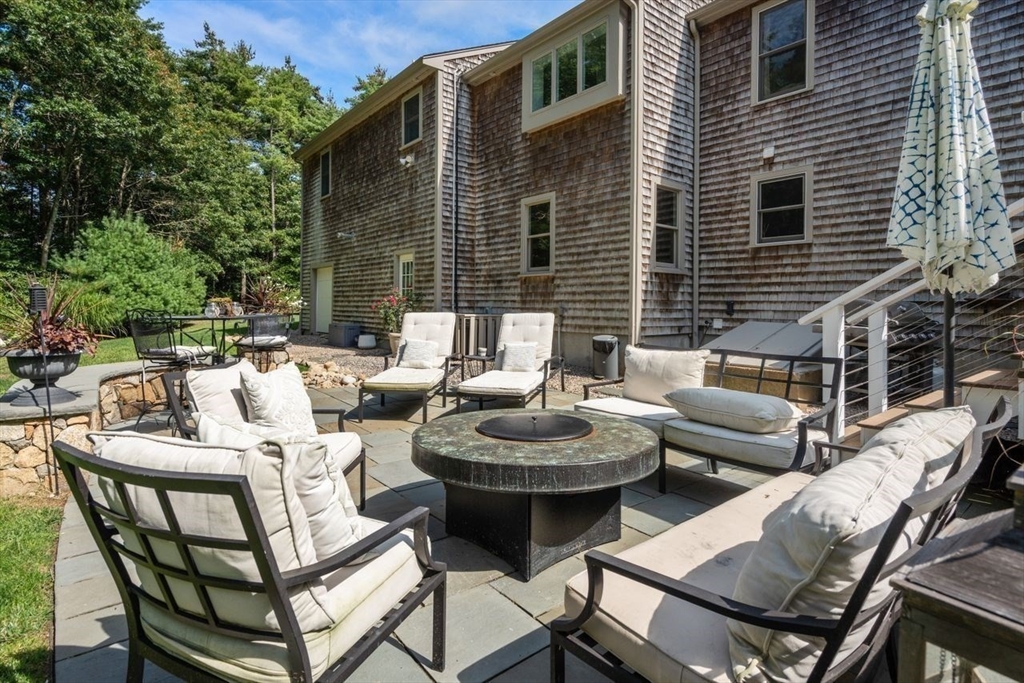 9 Mayflower Lane Rochester, MA 02770 - Photo 30 of 40 a view of a patio with couple of chairs