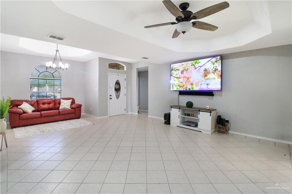 21412 Rusty Lane Harlingen, TX 78552 - Photo 2 of 35 a living room with furniture and a flat screen tv